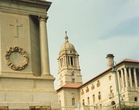 a stone monument and a stone building with a cupola tower