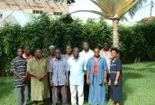 11 men and women from the Ministy of Finance of Guinea Bissau pose on the lawn