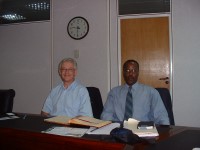 DevPar consultant seated at a conference table with a Ugandan representative